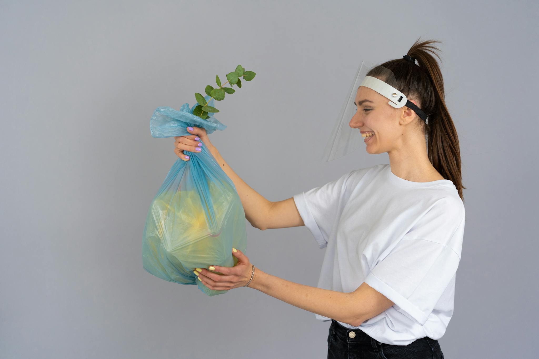 Smiling Woman Holding A Recyclable Bag With